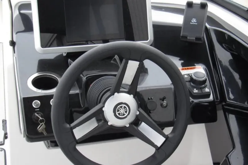 Slide: The Image of 2024 Yamaha Boats AR250 steering console with modern controls and display. - 6