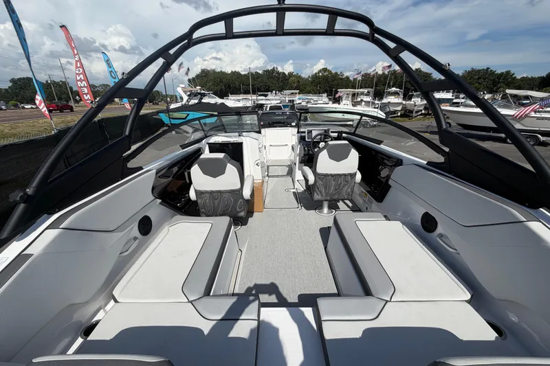 Slide: The Image of 2024 Yamaha Boats AR250 interior with sleek seating and modern design. - 11
