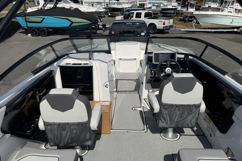 Slide: The Image of 2024 Yamaha Boats AR250 interior with modern seating and dashboard controls. - 12