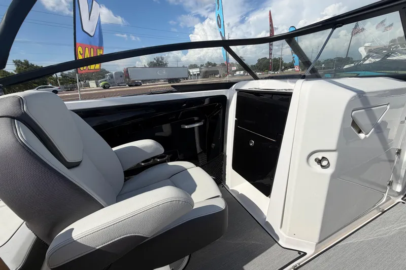 Slide: The Image of 2024 Yamaha Boats AR250 interior with sleek seating and modern dashboard design. - 15