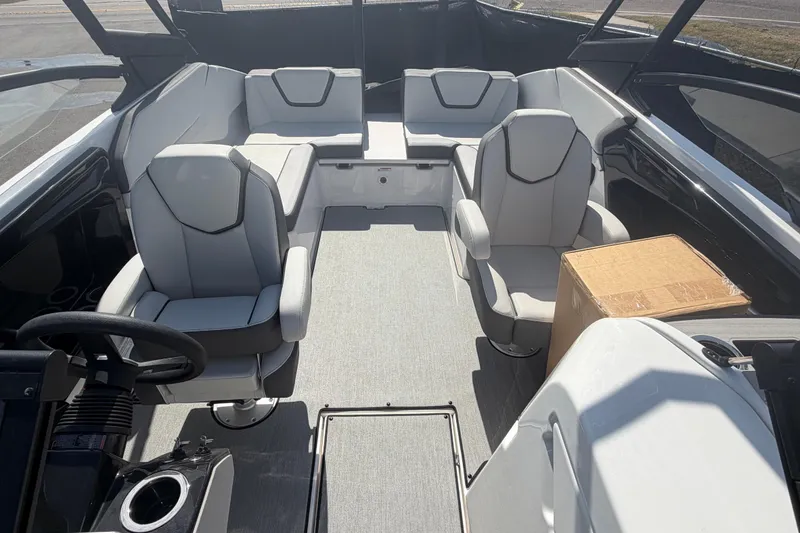 Slide: The Image of 2024 Yamaha Boats AR250 interior with modern seating and steering wheel. - 21