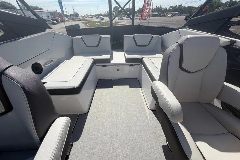 Slide: The Image of 2024 Yamaha Boats AR250 interior with sleek seating and modern design. - 22