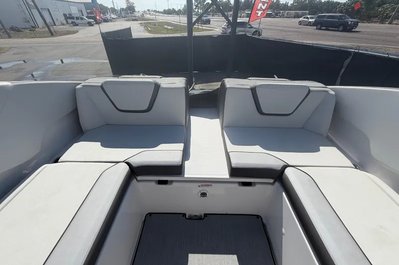 Slide: The Image of 2024 Yamaha Boats AR250 interior seating with modern design and comfortable upholstery. - 23