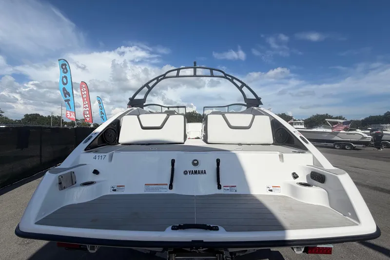 Slide: The Image of 2024 Yamaha Boats AR250, rear view, showcasing sleek design and spacious seating. - 3