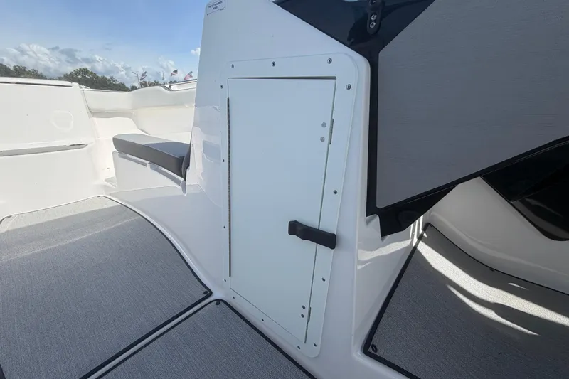 Slide: The Image of 2025 Yamaha Boats AR250 interior with seating and storage compartment, featuring sleek design and modern finishes. - 32