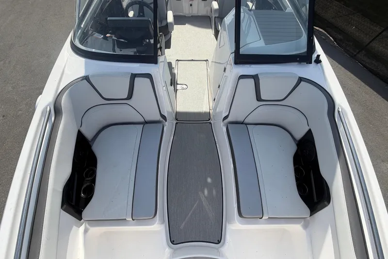 Slide: The Image of Interior view of a modern boat with white seating and gray flooring. - 39