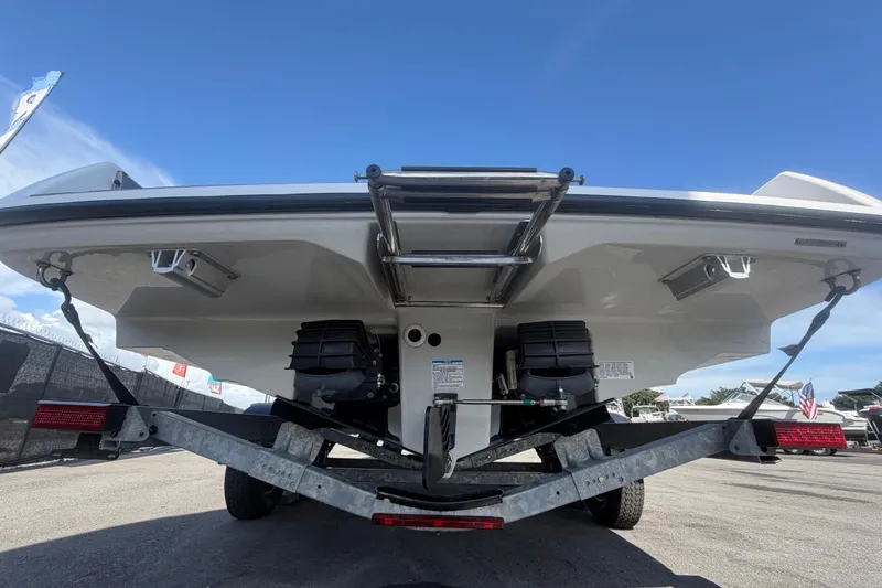 Slide: The Image of The image shows the rear of a Yamaha AR250 boat on a trailer. - 4