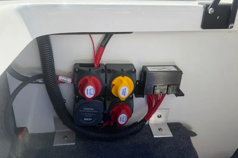 Slide: The Image of Electrical panel of a 2025 Yamaha Boats AR250, featuring switches and wiring. - 50
