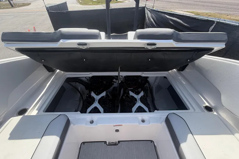 Slide: The Image of 2025 Yamaha Boats AR250 engine compartment with open hatch, showcasing dual engines. - 52