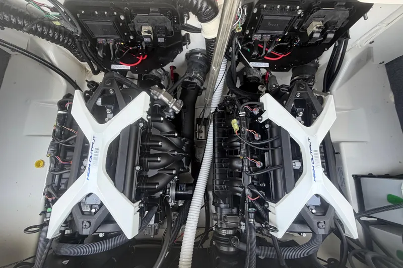 Slide: The Image of 2025 Yamaha Boats AR250 engine compartment showcasing dual high-output engines. - 54