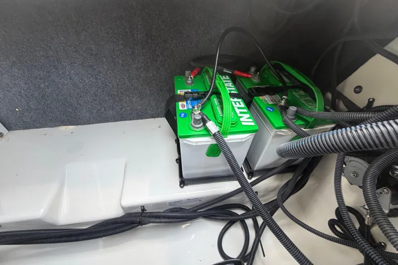 Slide: The Image of Batteries in a 2025 Yamaha Boats AR250, showcasing wiring and installation details. - 55