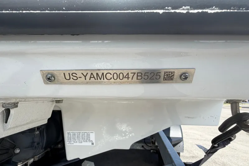 Slide: The Image of 2024 Yamaha Boats AR250 hull identification number plate with QR code. - 59