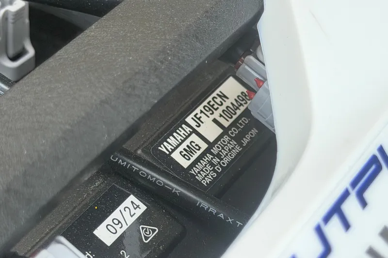 Slide: The Image of Close-up of Yamaha AR250 2025 model engine label with specifications. - 60
