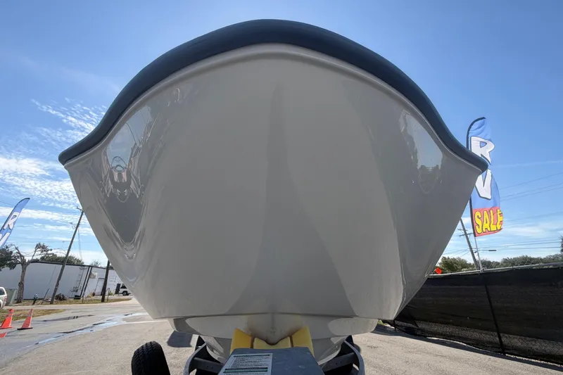 Slide: The Image of 2024 Yamaha Boats AR250 bow view under clear blue sky. - 8