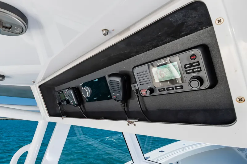 Slide: The Image of Onslow Bay 41 boat console with Garmin and Fusion devices. - 15