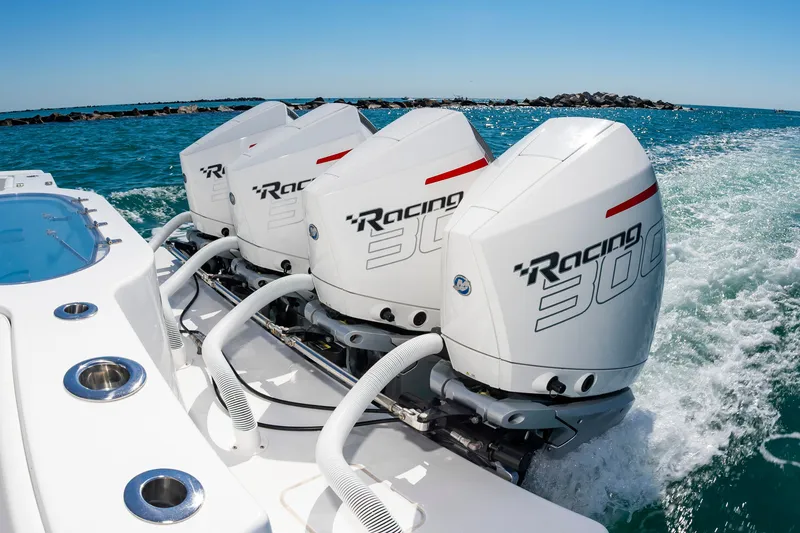 Slide: The Image of Onslow Bay 41 boat with triple outboard engines on water. - 21