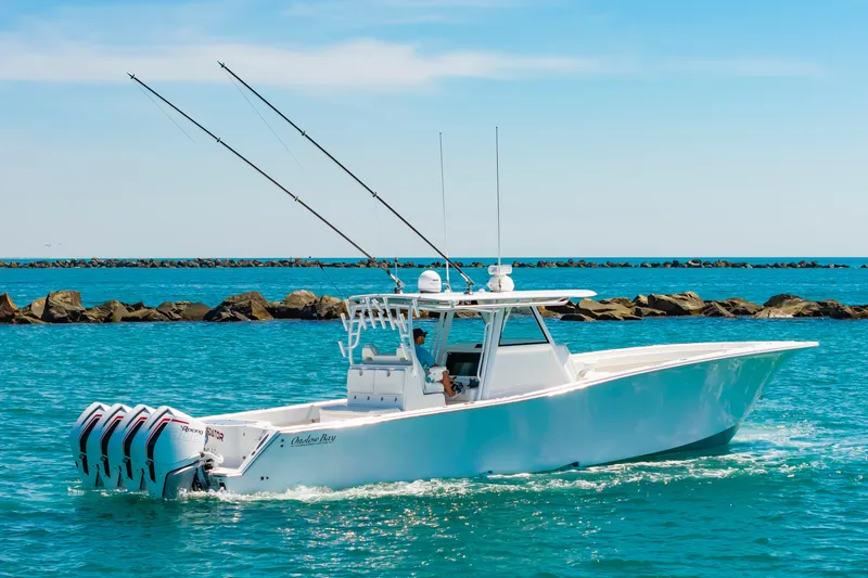 Slide: The Image of Onslow Bay 41 boat 2023 on water, blue sky. - 47