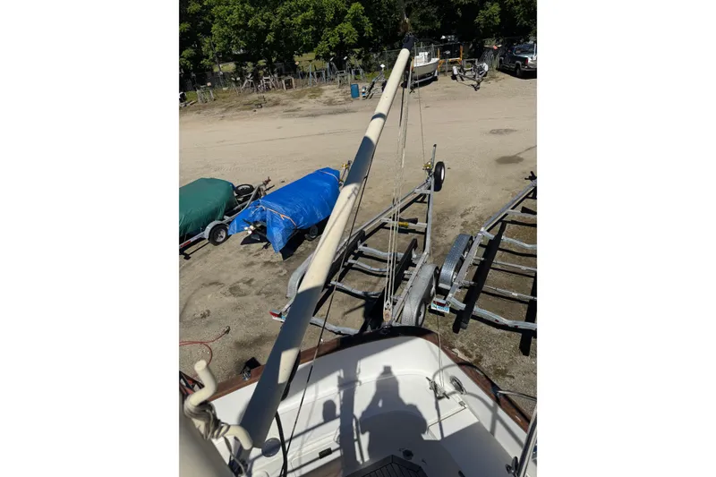 Slide: The Image of 1998 Pacific Seacraft Pilothouse 32 sailboat on trailer, covered with tarps. - 17
