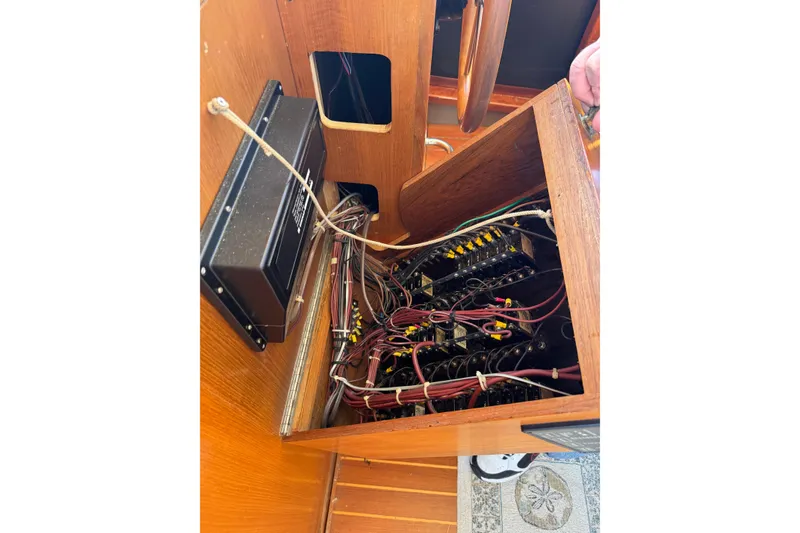 Slide: The Image of Electrical panel and wiring inside a 1998 Pacific Seacraft Pilothouse 32 sailboat. - 26
