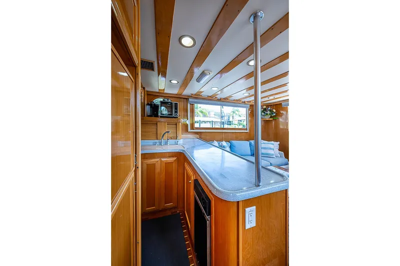 Slide: The Image of Luxurious 2003 Magna Marine Nova Scotia 47 yacht interior with modern kitchen and seating area. - 10