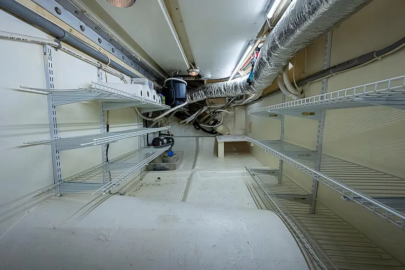 Slide: The Image of Engine room of 2003 Magna Marine Nova Scotia 47 with shelving and ductwork. - 16