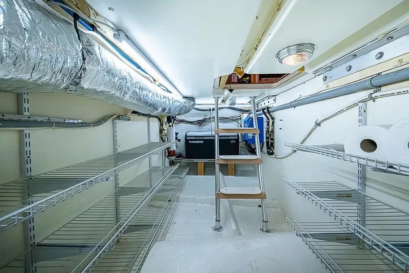 Slide: The Image of Engine room of 2003 Magna Marine Nova Scotia 47 with shelves and ventilation ducts. - 17
