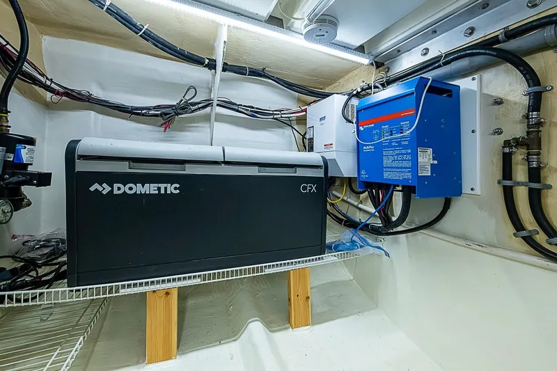 Slide: The Image of Electrical setup in a 2003 Magna Marine Nova Scotia 47 boat, featuring Dometic CFX unit. - 18