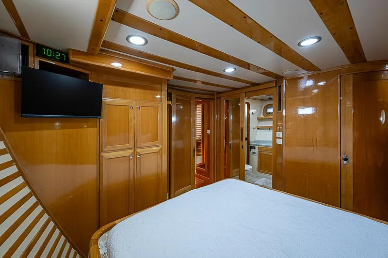 Slide: The Image of Luxurious 2003 Magna Marine Nova Scotia 47 yacht cabin with wood paneling and modern amenities. - 21