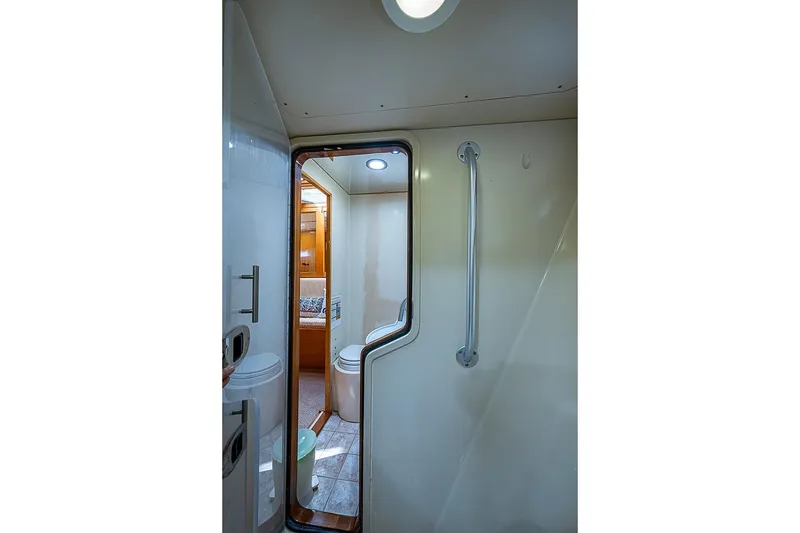 Slide: The Image of Interior view of 2003 Magna Marine Nova Scotia 47 yacht bathroom with modern fixtures. - 33