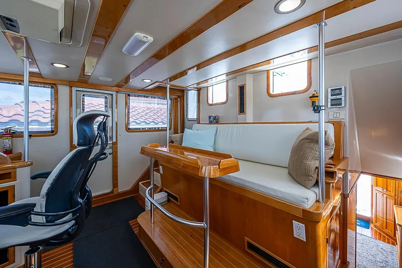 Slide: The Image of Interior of 2003 Magna Marine Nova Scotia 47, featuring seating and helm station. - 37