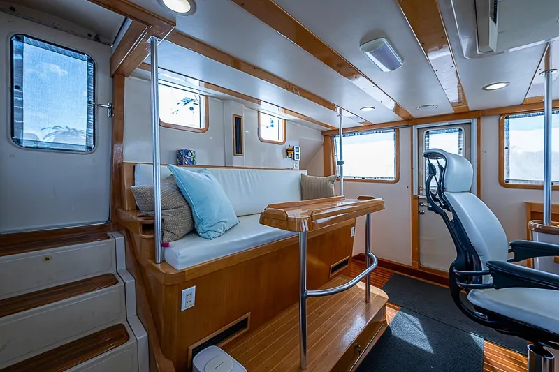 Slide: The Image of Interior of 2003 Magna Marine Nova Scotia 47, featuring seating and helm station. - 41