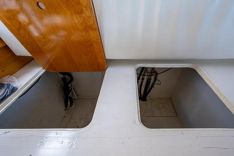 Slide: The Image of Interior compartments of 2003 Magna Marine Nova Scotia 47 boat, featuring wooden and white surfaces. - 45