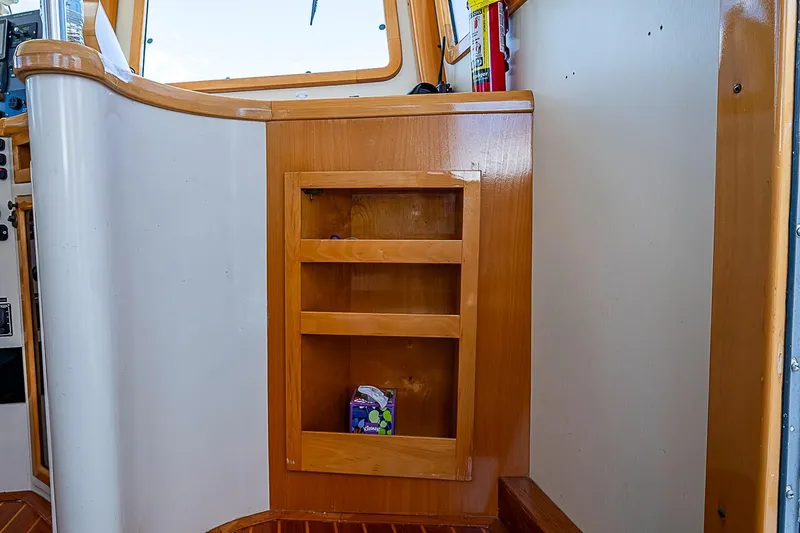 Slide: The Image of Interior of 2003 Magna Marine Nova Scotia 47 with wooden shelving and fire extinguisher. - 46