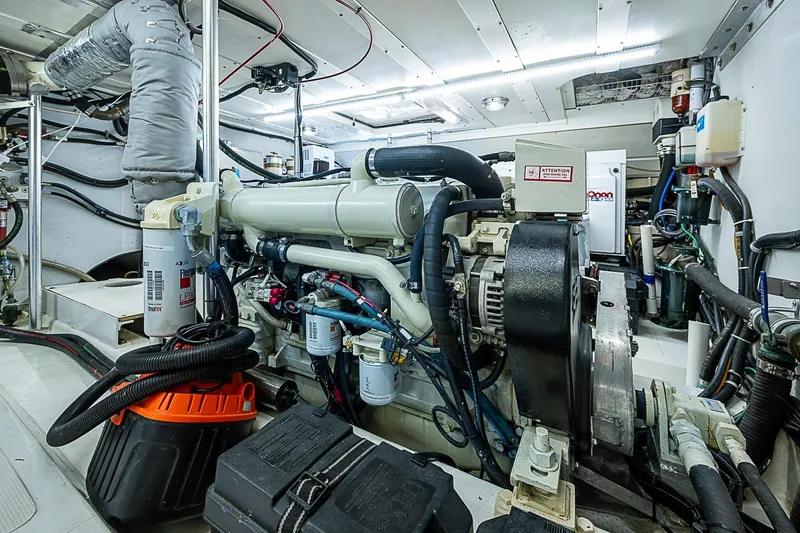 Slide: The Image of Engine room of 2003 Magna Marine Nova Scotia 47, showcasing detailed mechanical components. - 50