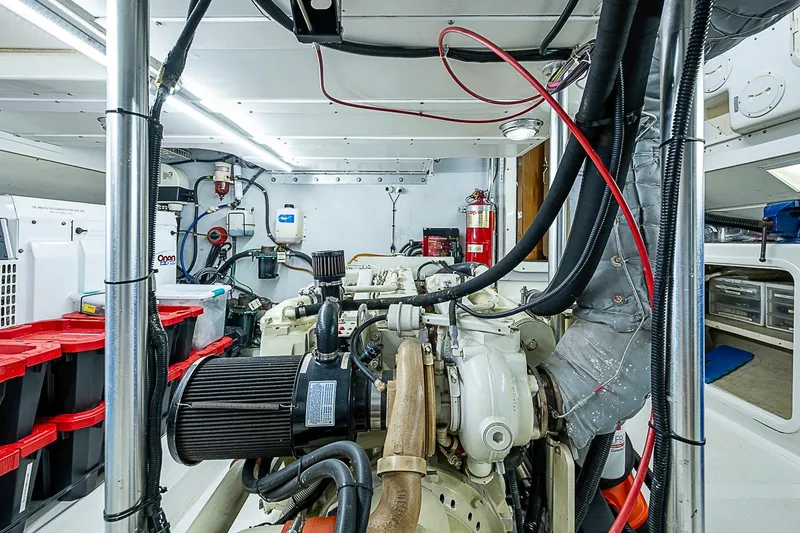 Slide: The Image of Engine room of 2003 Magna Marine Nova Scotia 47, featuring organized equipment and storage. - 57