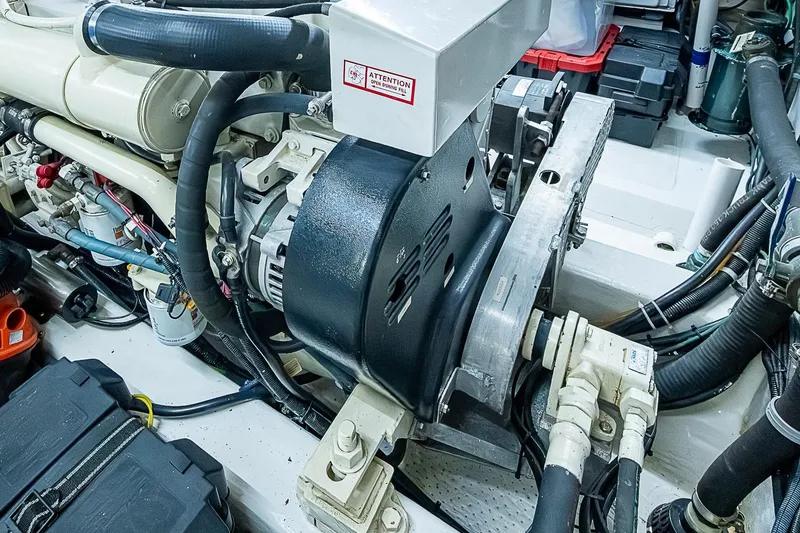 Slide: The Image of Engine room of 2003 Magna Marine Nova Scotia 47, showcasing mechanical components and wiring. - 58