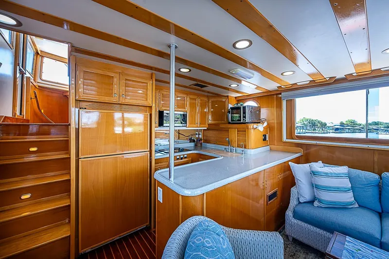 Slide: The Image of Luxurious 2003 Magna Marine Nova Scotia 47 yacht interior with wooden cabinetry and modern amenities. - 6