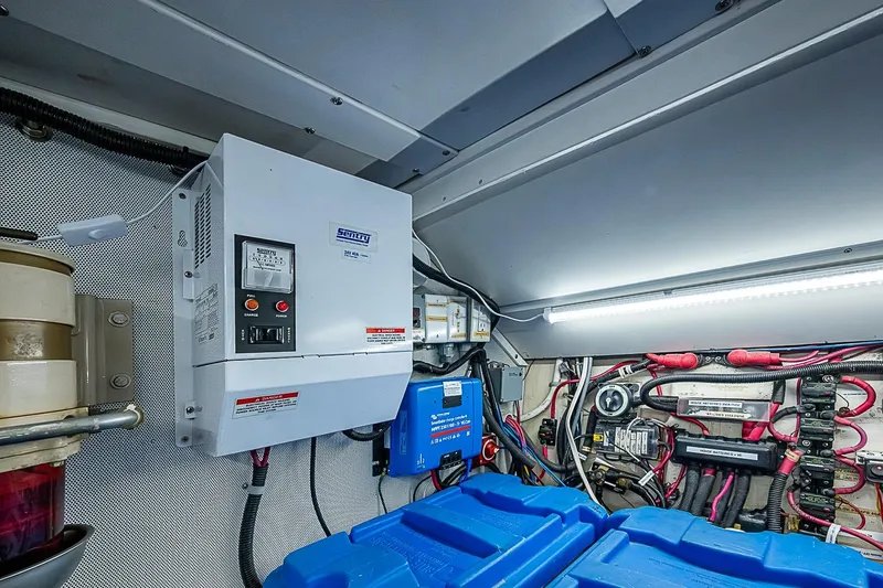 Slide: The Image of Engine room of 2003 Magna Marine Nova Scotia 47, featuring electrical systems and wiring. - 60