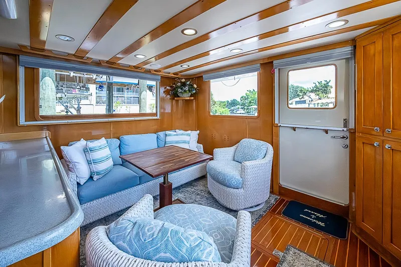 Slide: The Image of Luxurious interior of 2003 Magna Marine Nova Scotia 47 yacht with cozy seating and wooden accents. - 7