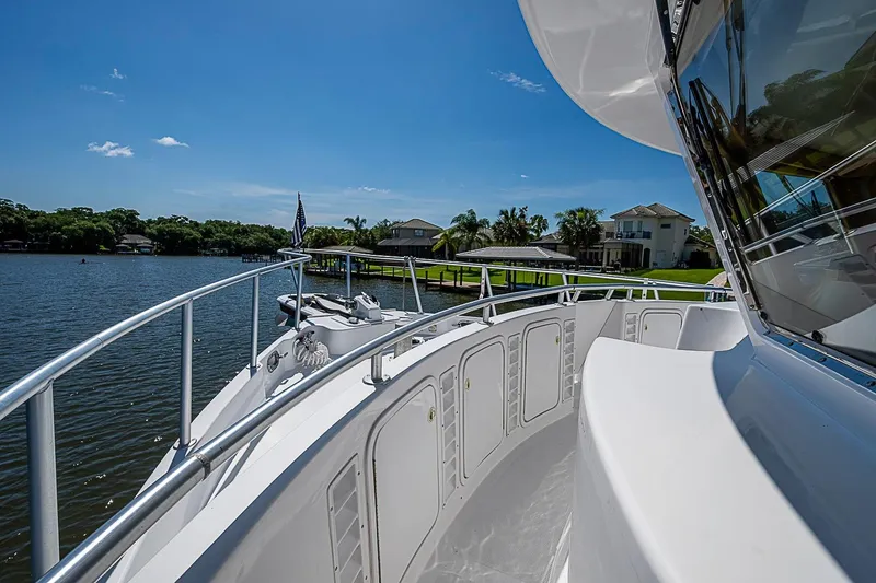 Slide: The Image of 2003 Magna Marine Nova Scotia 47 yacht on serene waterfront with clear blue sky. - 72