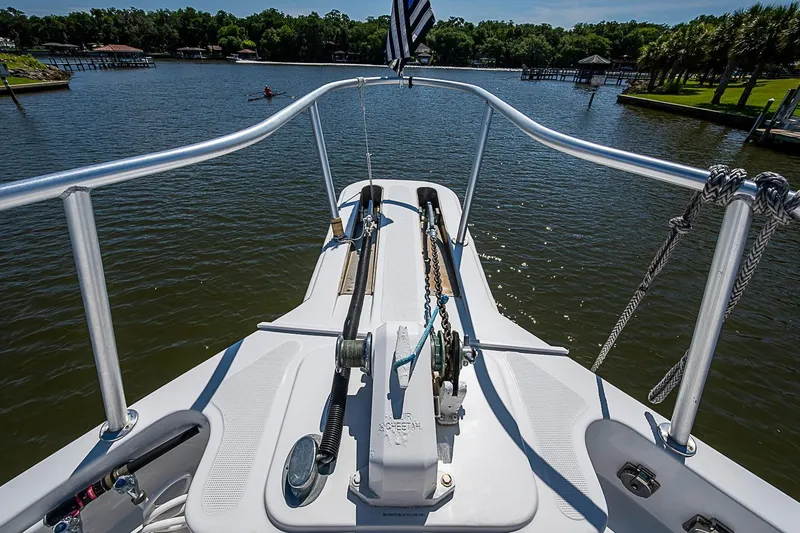 Slide: The Image of Bow view of 2003 Magna Marine Nova Scotia 47 yacht on a serene lake. - 74