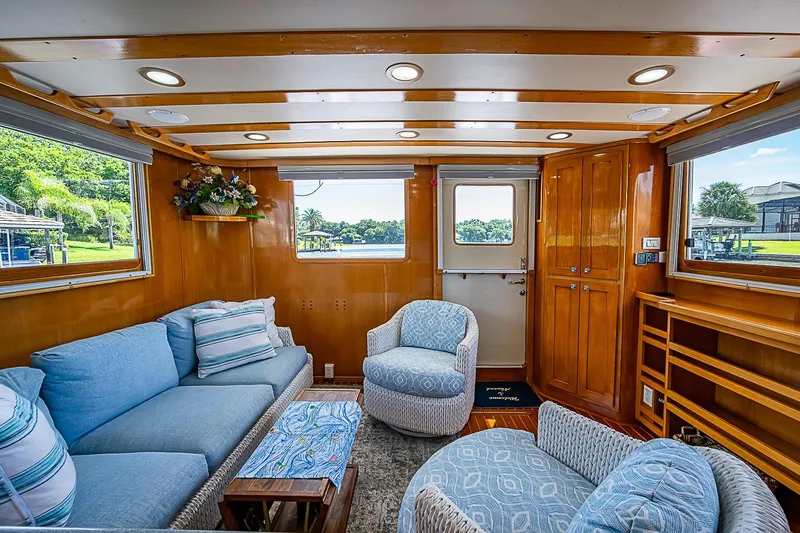 Slide: The Image of Luxurious interior of 2003 Magna Marine Nova Scotia 47 yacht with plush seating and wooden accents. - 8