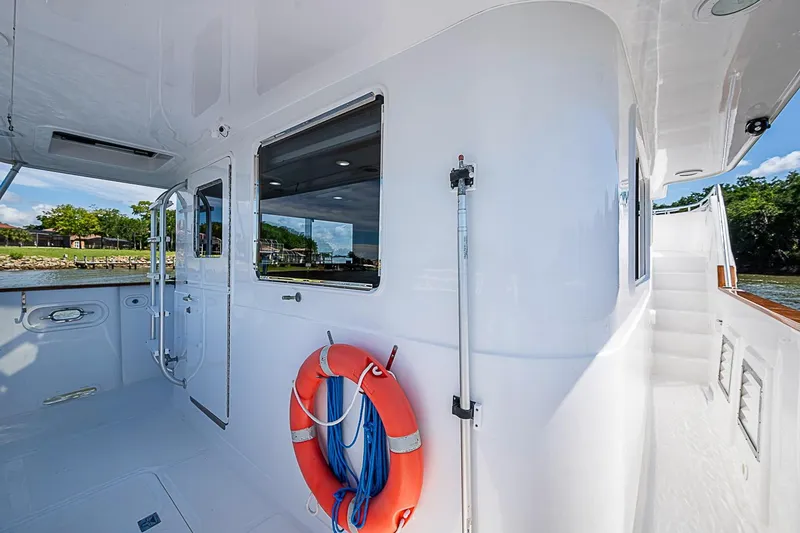 Slide: The Image of 2003 Magna Marine Nova Scotia 47 yacht deck with life preserver and scenic view. - 81