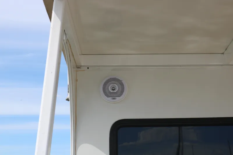 Slide: The Image of Exterior speaker on 2010 Skipperliner 480 Flybridge boat under clear sky. - 12