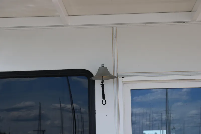 Slide: The Image of Bell on Skipperliner 480 Flybridge yacht, 2010 model, with window reflection. - 13