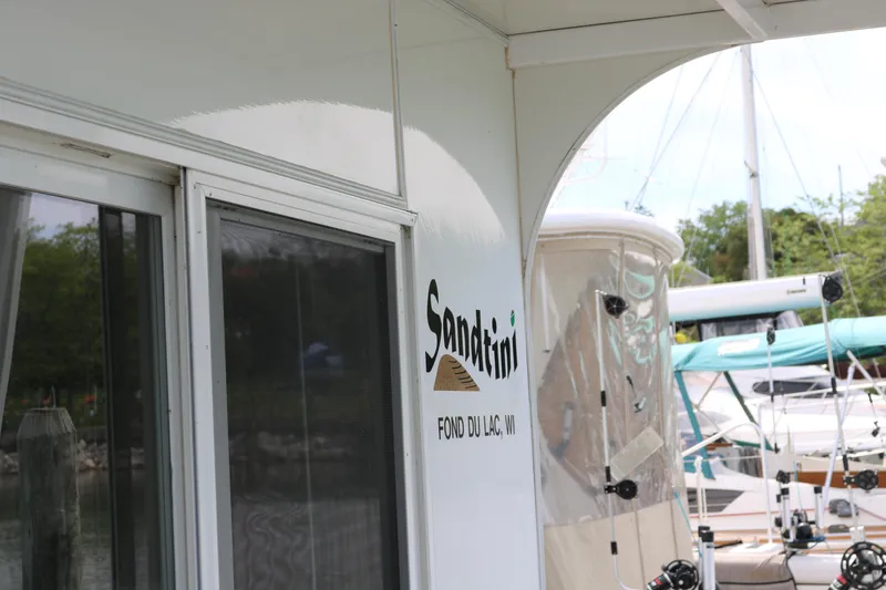 Slide: The Image of Skipperliner 480 Flybridge 2010 docked, featuring "Sandtini" signage, Fond du Lac, WI. - 14