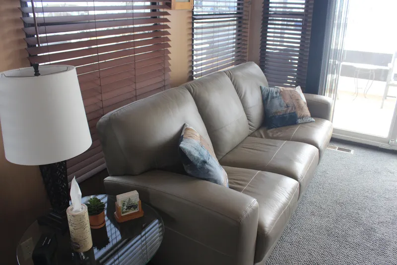 Slide: The Image of Luxurious interior of 2010 Skipperliner 480 Flybridge with leather sofa and decorative pillows. - 17