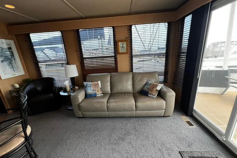 Slide: The Image of Luxurious Skipperliner 480 Flybridge 2010 interior with leather sofa and marina view. - 18