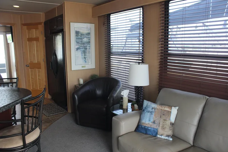 Slide: The Image of Interior of 2010 Skipperliner 480 Flybridge with modern furnishings and large windows. - 23
