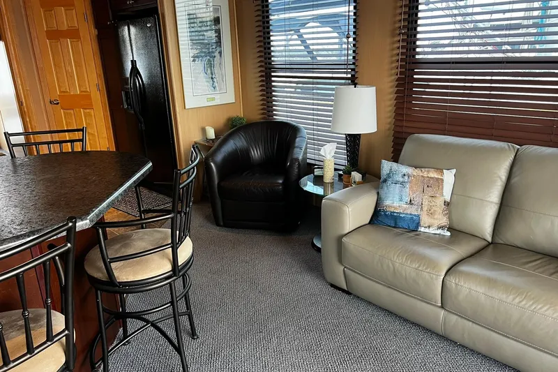 Slide: The Image of Interior of 2010 Skipperliner 480 Flybridge with modern seating and decor. - 25